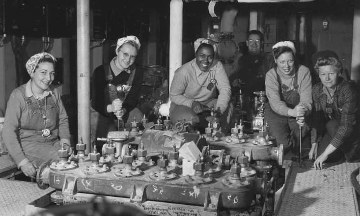 Women shipfitters worked on board the USS Nereus shown as they neared completion of the floor in a part of the engine room at the US Navy Yard, Mare Island, California