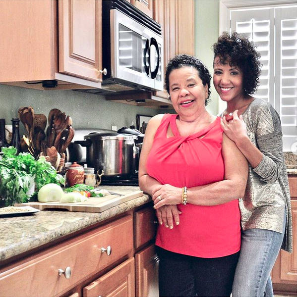 Bren Herrera and her mother in a kitchen