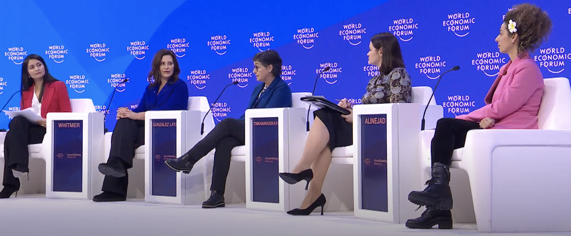 a group of 5 women speaking on a stage about reaching gender parity in leadership at the world economic forum conference in Davos