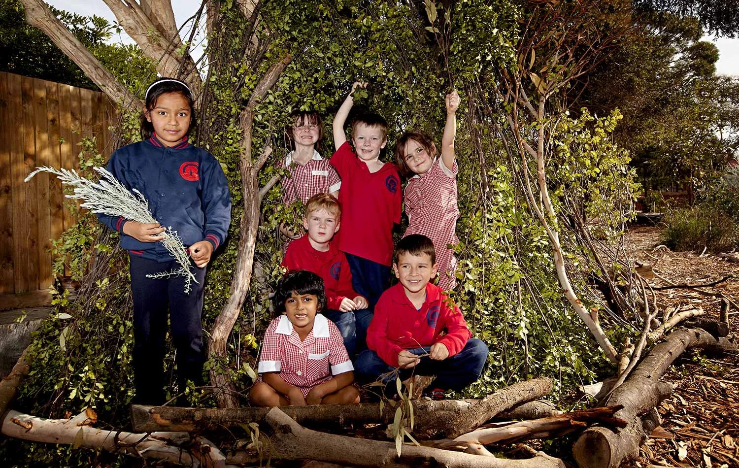 Outdoor activities including tree climbing and cubby house building