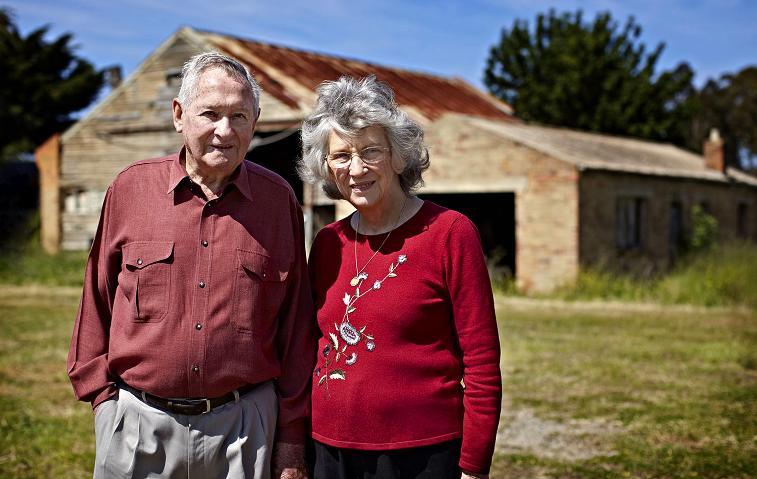 The Milburns, Dorothy and John, married for 59 years, retired Keilor Market Gardeners, in front of the original barn john's Grandfather built in Keilor.
