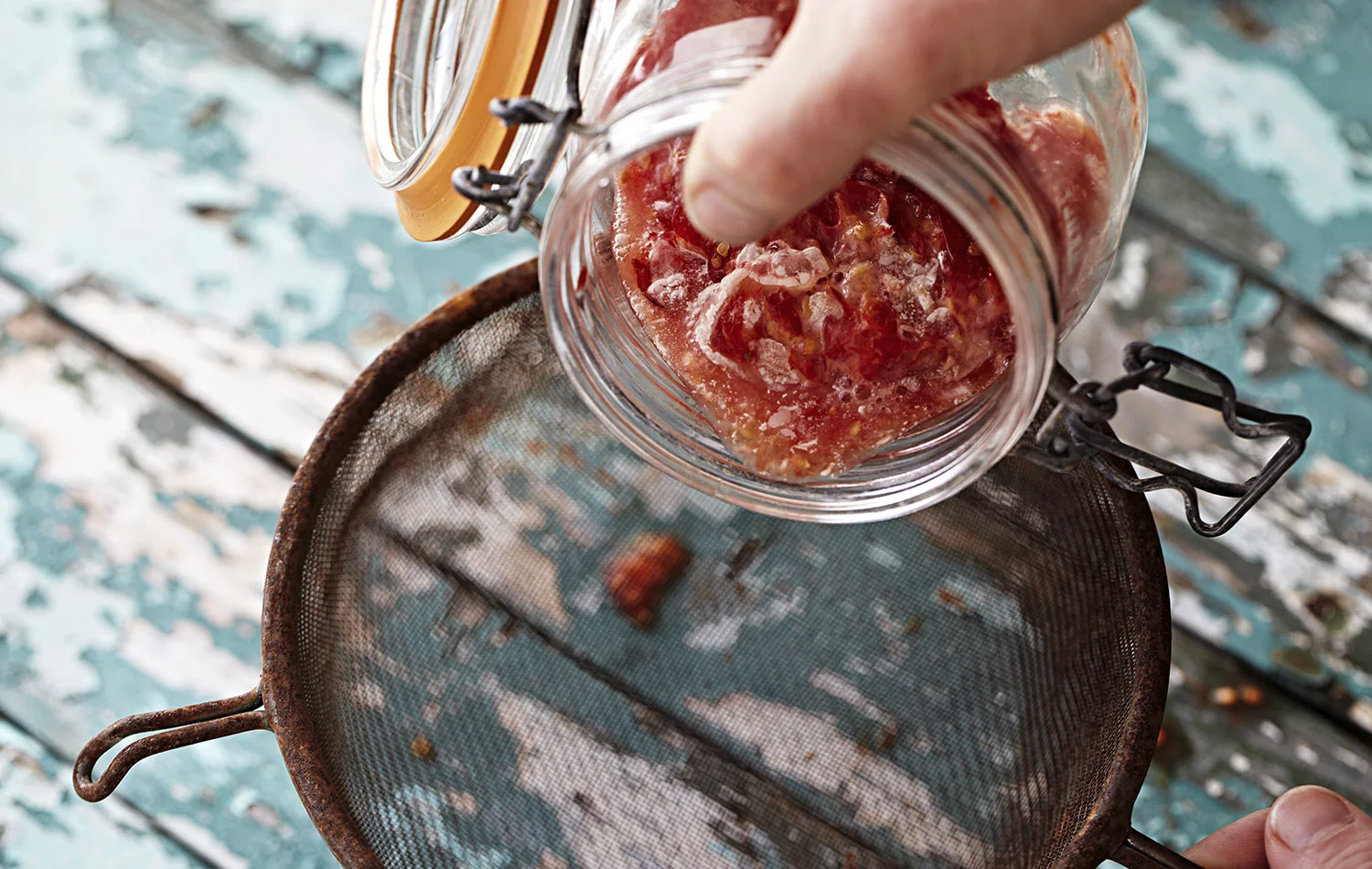 Transfer the pulp to a sieve, one that is fine enough so you do not lose the seeds.