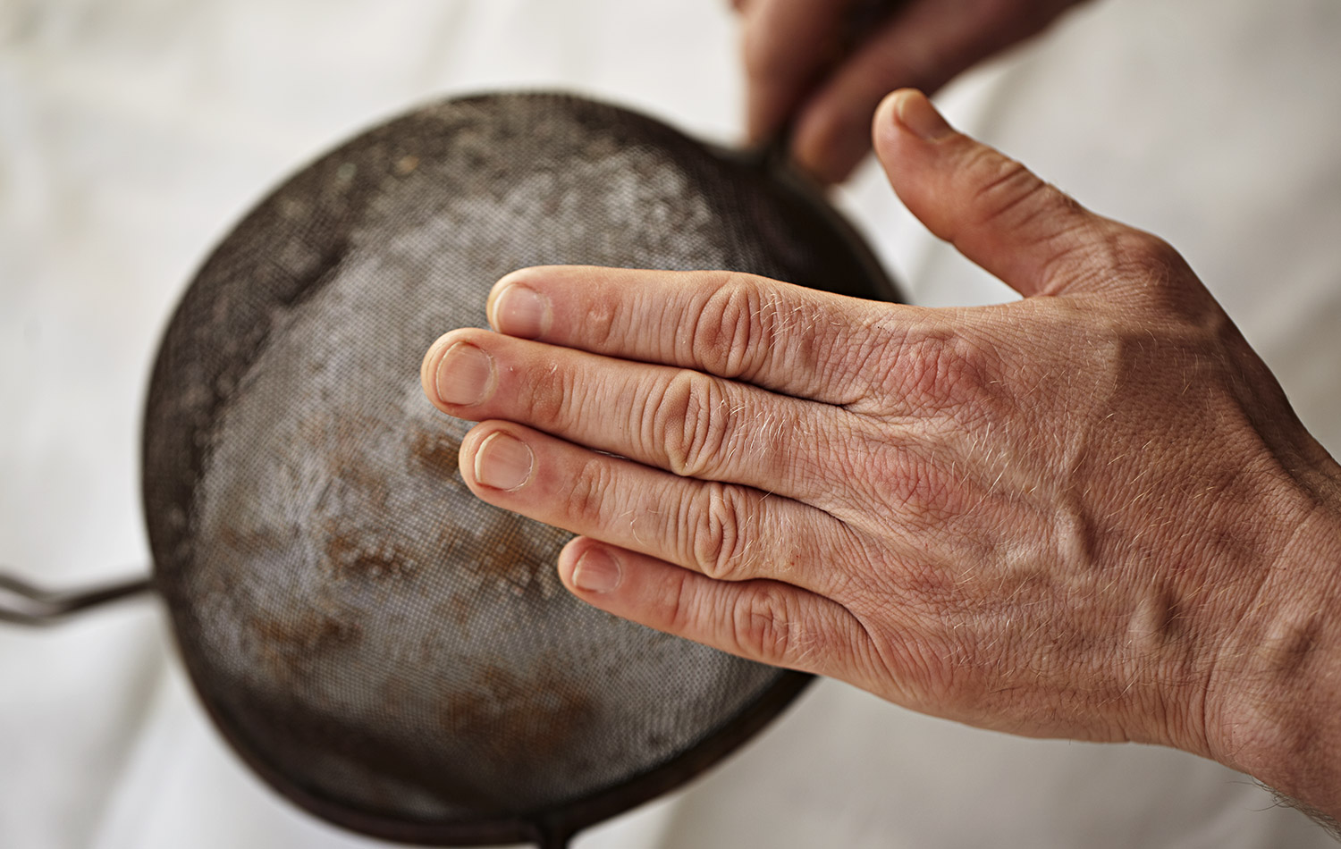 Turn the seed out onto a cloth or kitchen paper. I use a cloth as I find the kitchen paper sticks to the seed and then the seed becomes difficult to remove. It is also trickier to separate the seed when it's on kitchen paper. 
