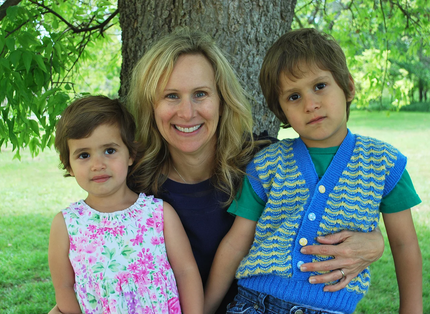Aydin and Juju bench with mom.jpg