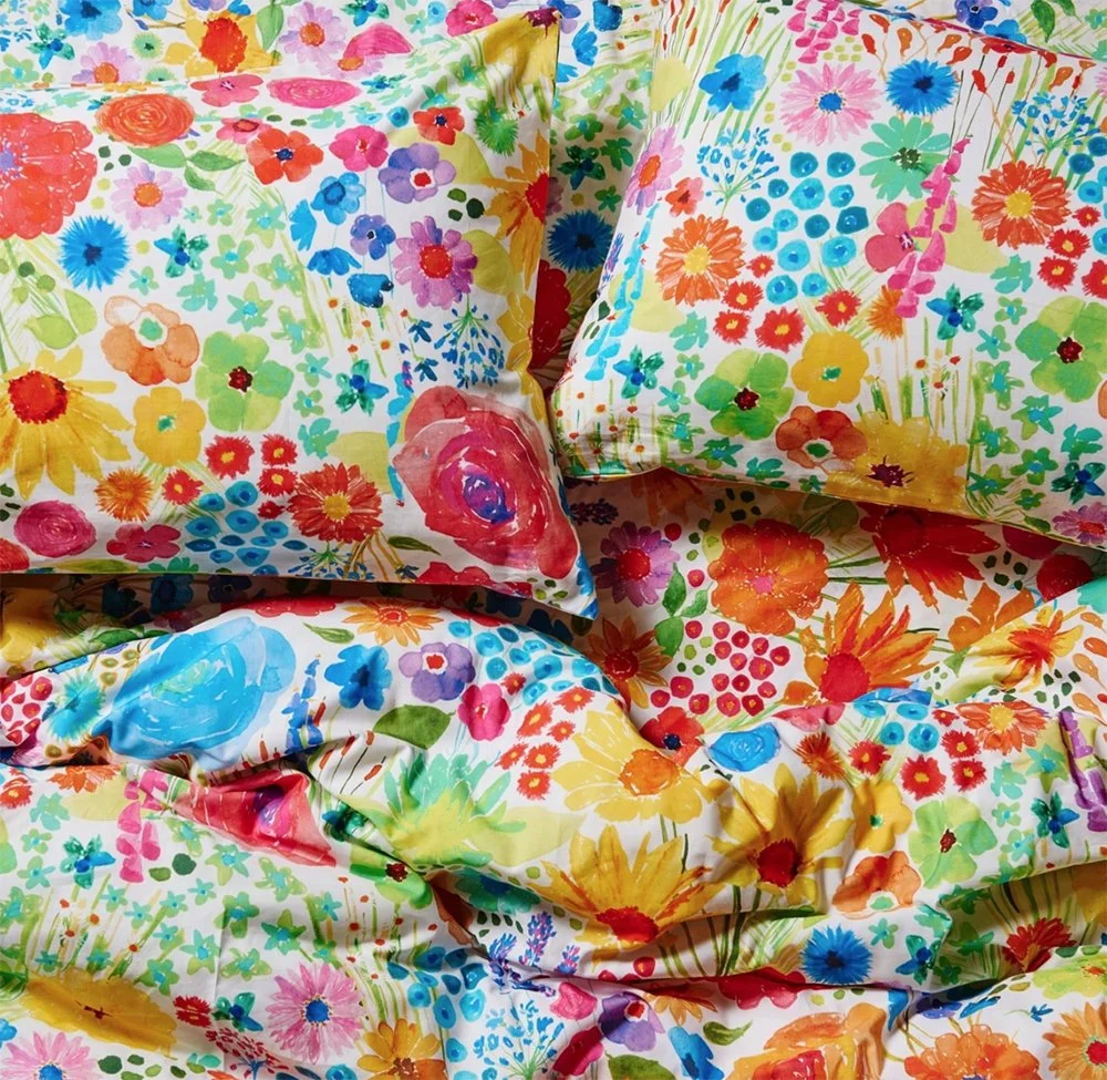 Kip&Co repeat print textile design for bedding, homewares and apparel. Bright watercolour floral print on light background.