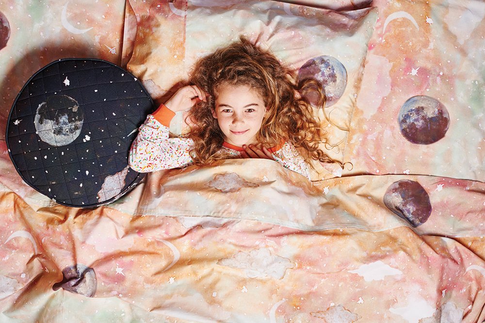 Kip&Co repeat print textile design for bedding, homewares and apparel. Watercolour painting of dreamy starry night with full moon and colours. Two colour ways, in peachy dusk and dark night.