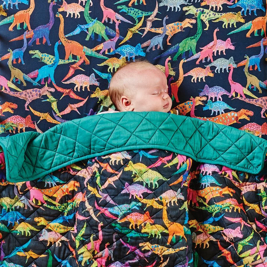 Textile design and seamless repeat print illustration for Kip&Co of colourful pencil drawn dinosaurs. Colourful playful print.