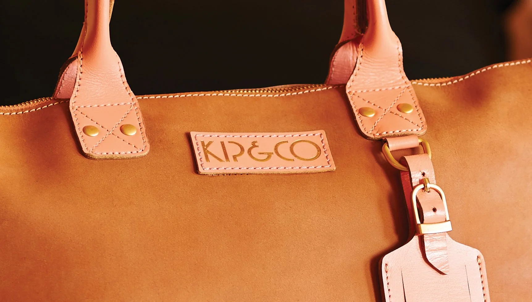 Roscher Creative brand mark design for Kip&Co embossed logo on label for leather bag.