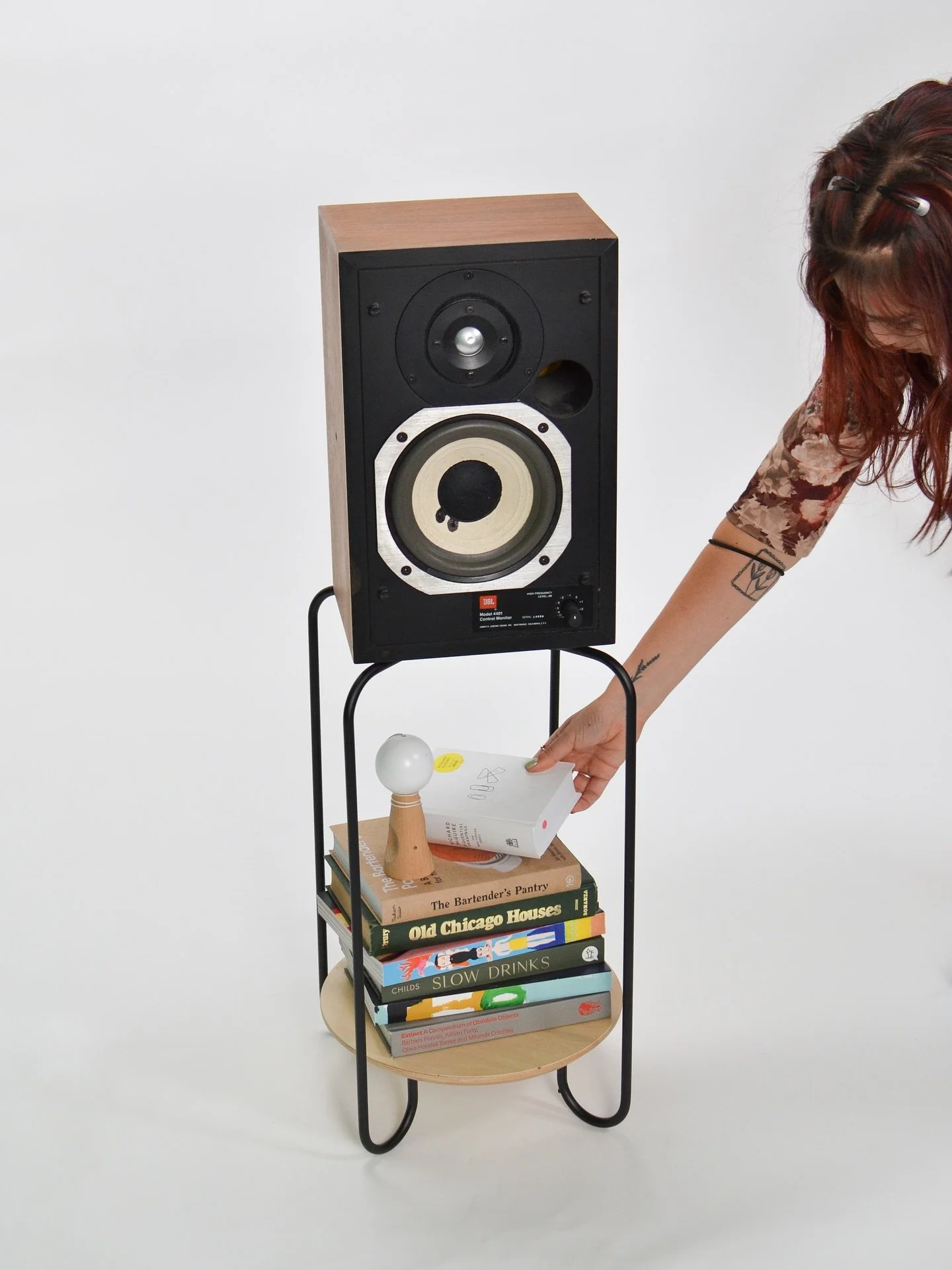 A DIY speaker stand built using the J-legs from the Mezzanine Collection.