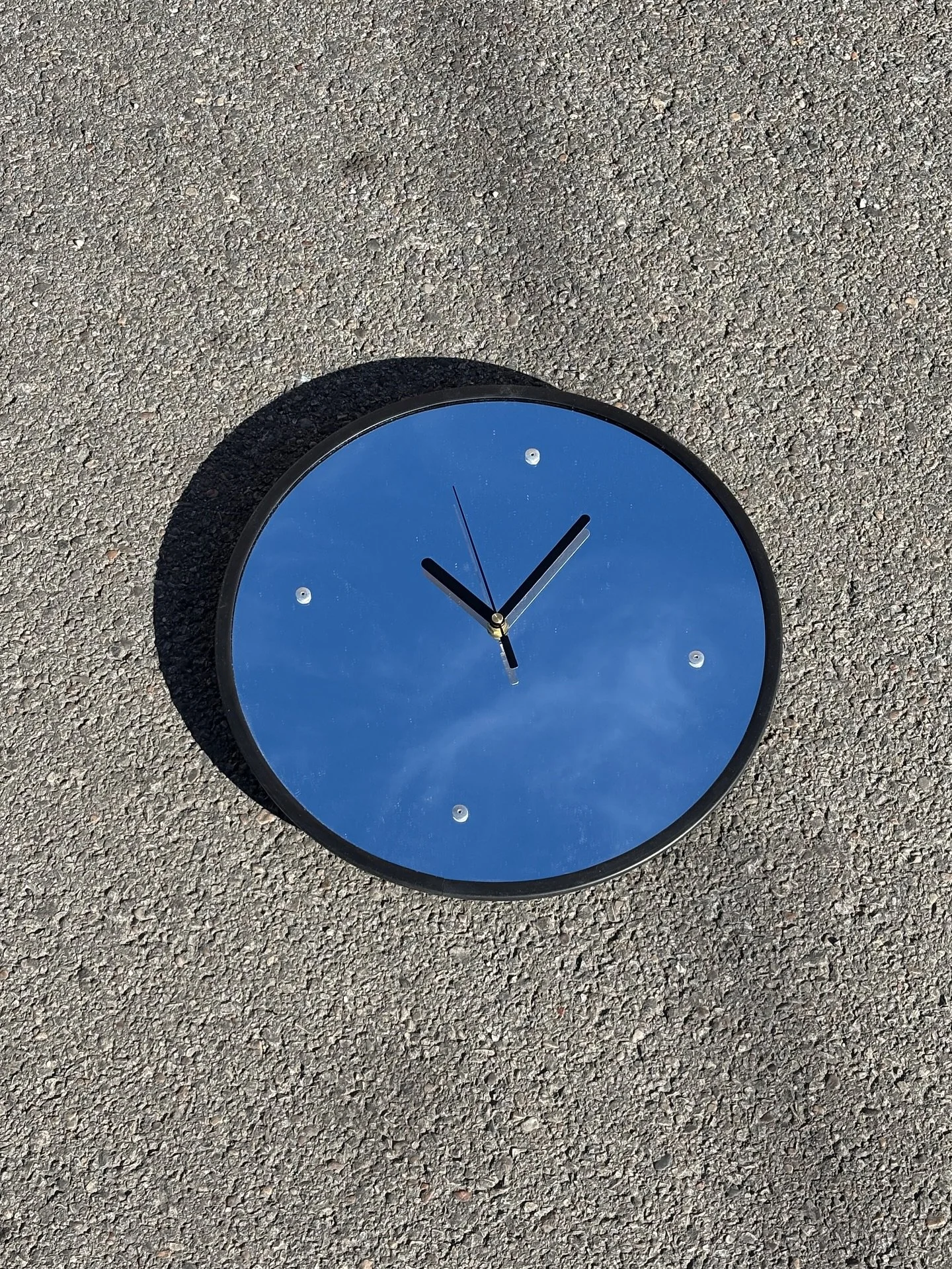 Reminiscent of industrial safety mirrors, N&ordm;6 is made from laser cut mirrored acrylic, rivets and rubber trim. The exposed rivets act as both a functional and an aesthetic detail&mdash;the clock face is riveted to bent aluminum brackets for secu