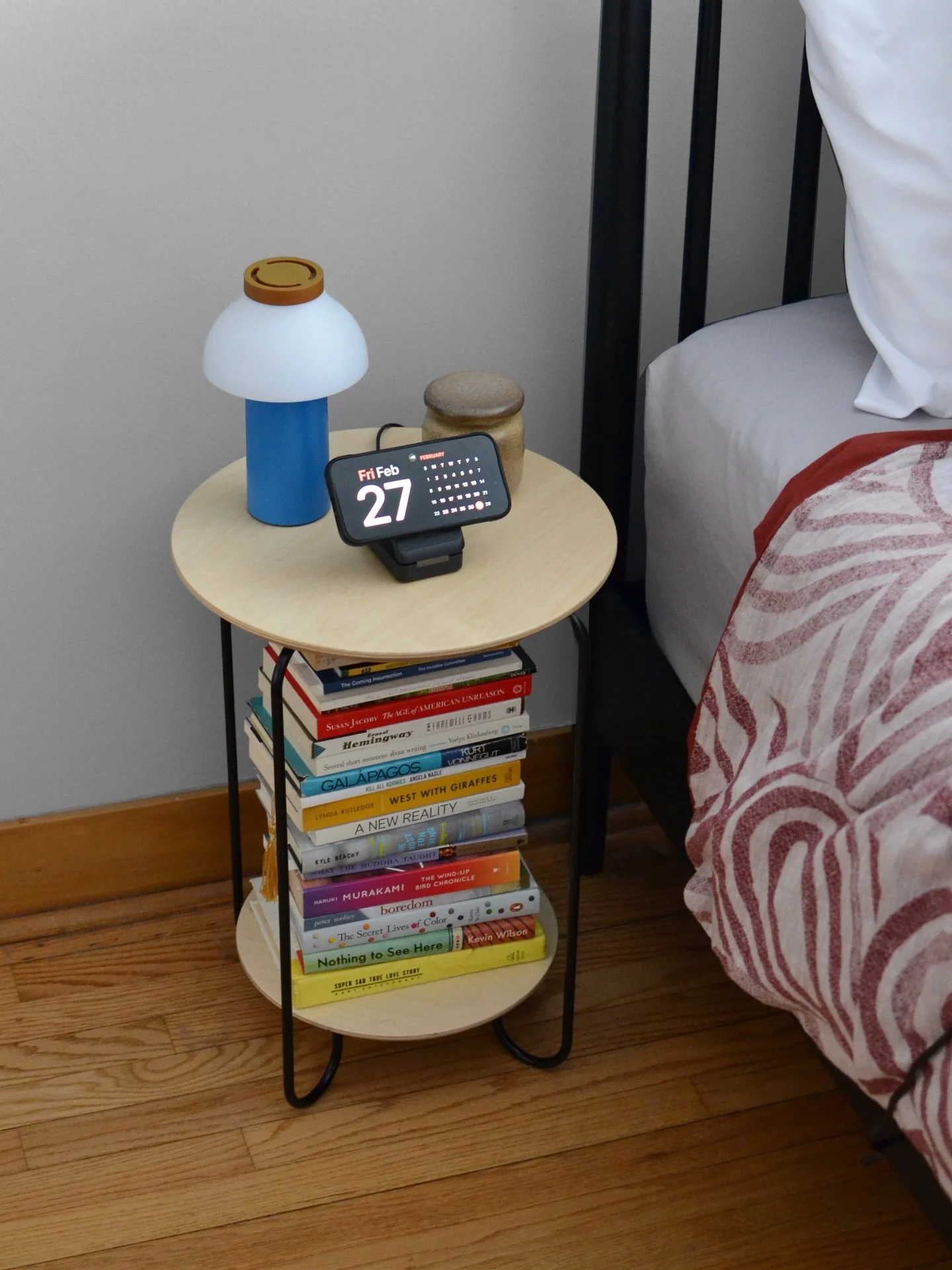 A nightstand with mezzanine level storage for all those books you haven&rsquo;t gotten through yet.