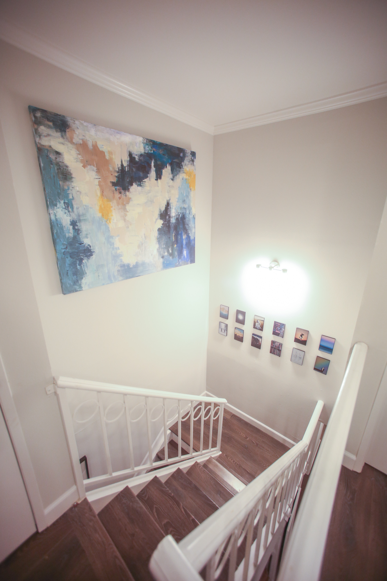  Stairwell with photos and a large 5' x 4' canvas I painted 