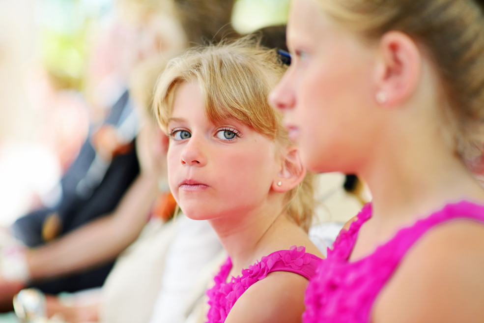 Flower girl gazing at the camera