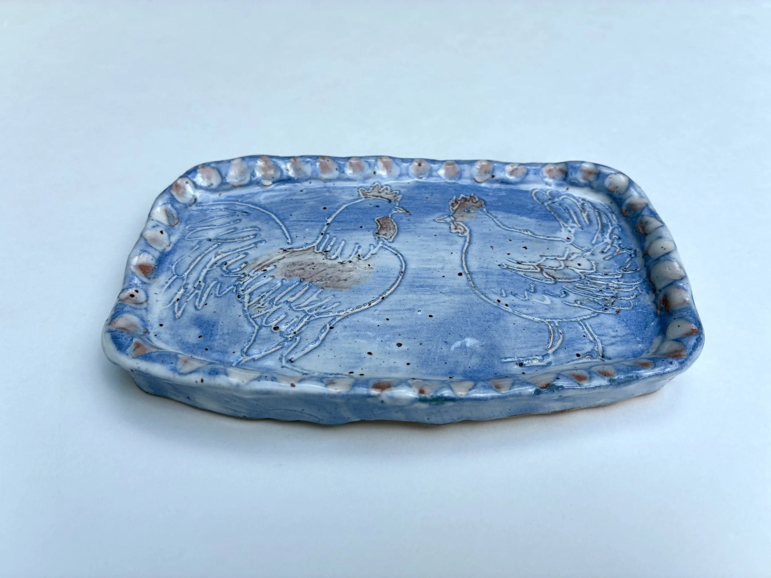    Cockerel &amp; Hen small dish.    Handshaped terracotta slip decoration. 2026 