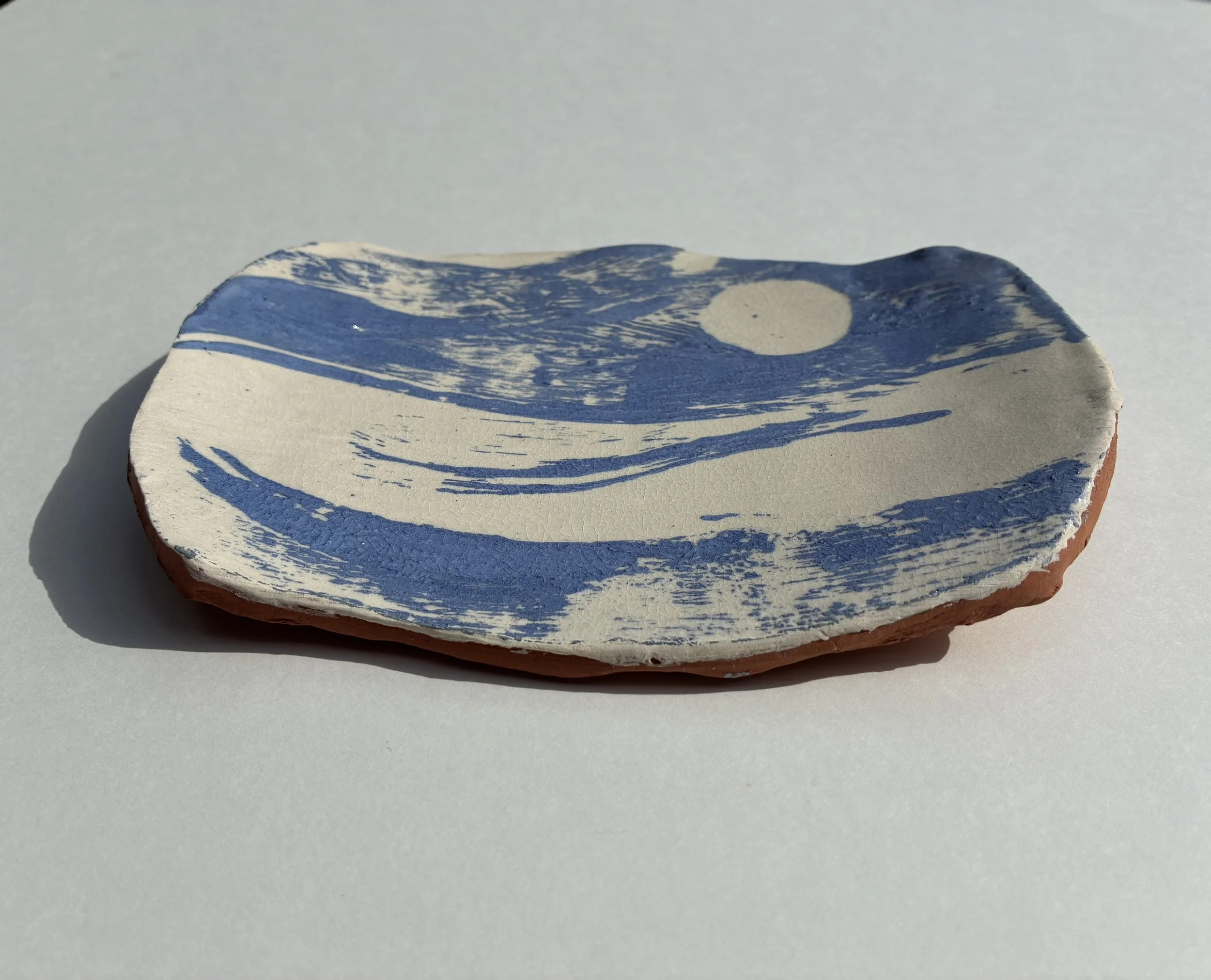    Full moon &amp; sea.   Handshaped terracotta small platter. Monoprint slip decoration, 2026 