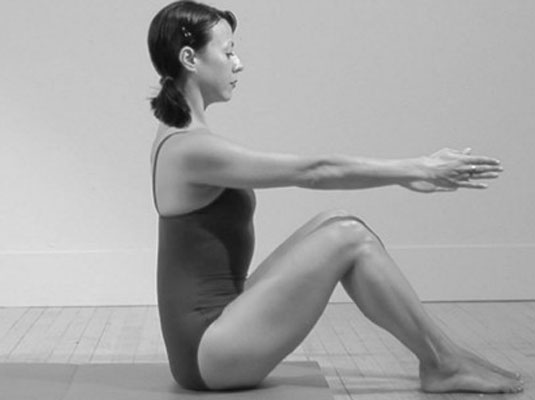 Starting position for the Pilates Roll Up/Roll Down. Notice the neutral spine. (www.mypilatesstyle.com)