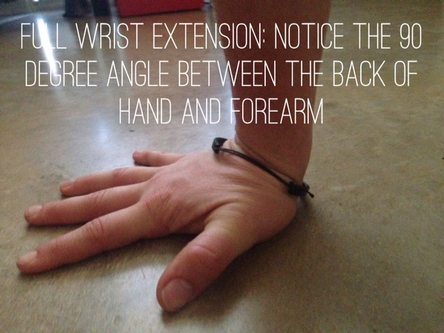 My wrists are sometimes tight- you can see that it's hard for my thumb to fully rest on the floor without a small bend..