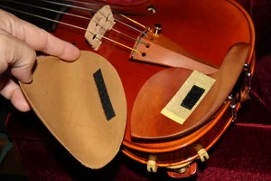 I used a stradpad for many years, although I eventually disliked the sonic dampening effect it had on my instrument. For some people, it's not a bother.