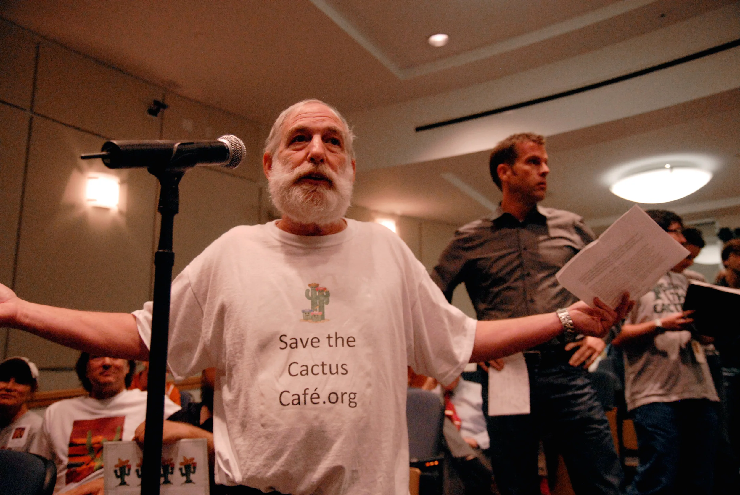 Cliff Meltz at the April 21, 2010 forum. Behind him, Cameron Smith awaits his turn at the microphone. (13)