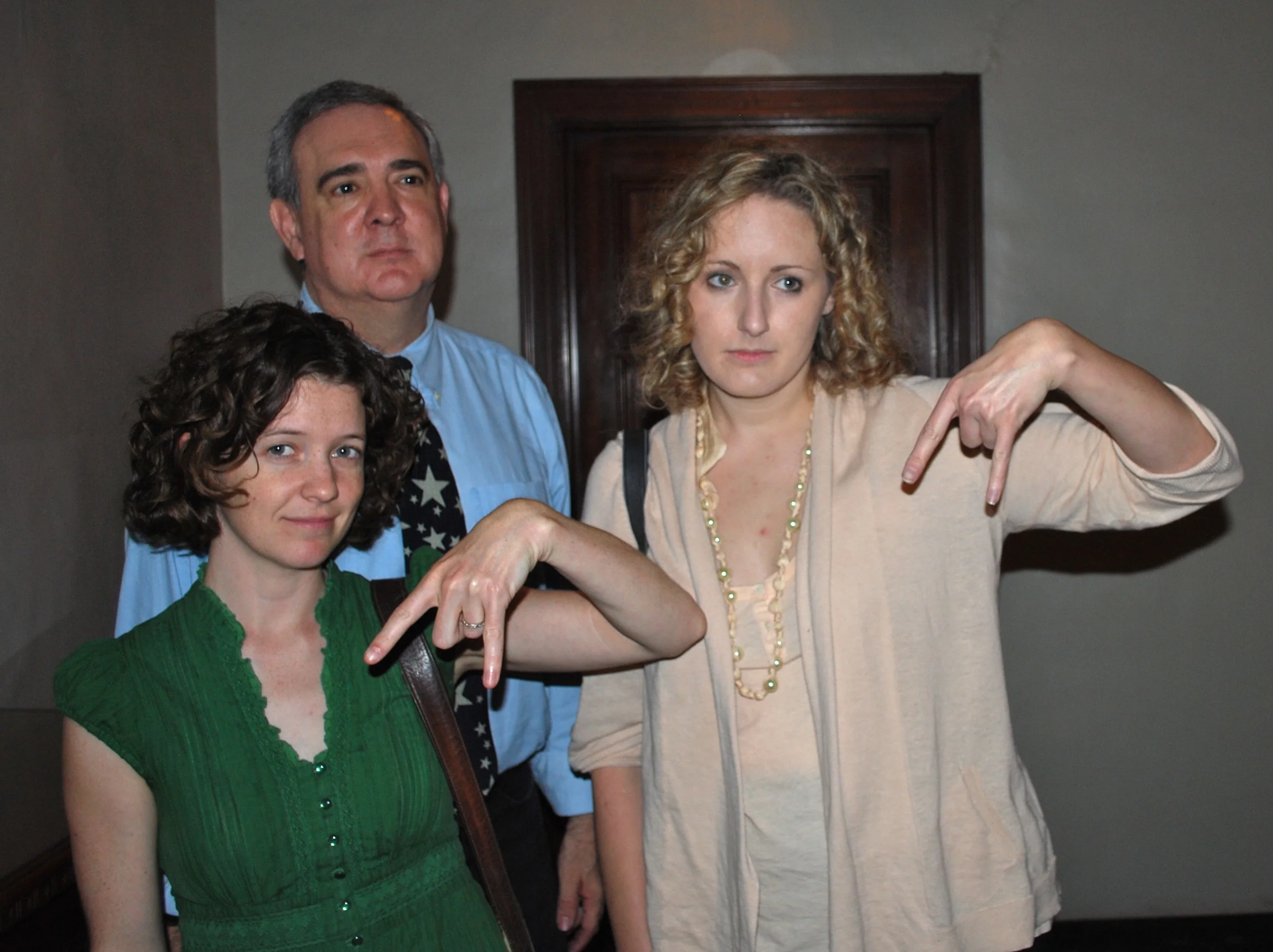 Horns down, as UT excludes Cactus advocates from a press conference, May 19, 2010. Hayley Gillespie (left), Prof. Tom Garza, and Tiffany Walker (14)