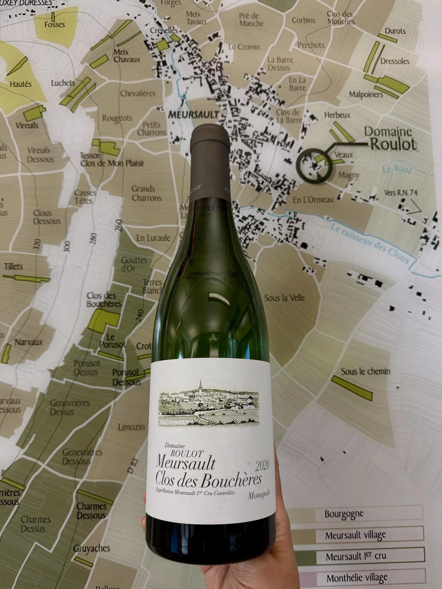 Jean-Marc Roulot&rsquo;s Clos des Bouch&egrave;res is a walled parcel within Les Bouch&egrave;res, bordering Le Porusot. The site features shallow, stony soils over oolitic limestone interlaced with marl and ancient clamshells&mdash;contributing a si