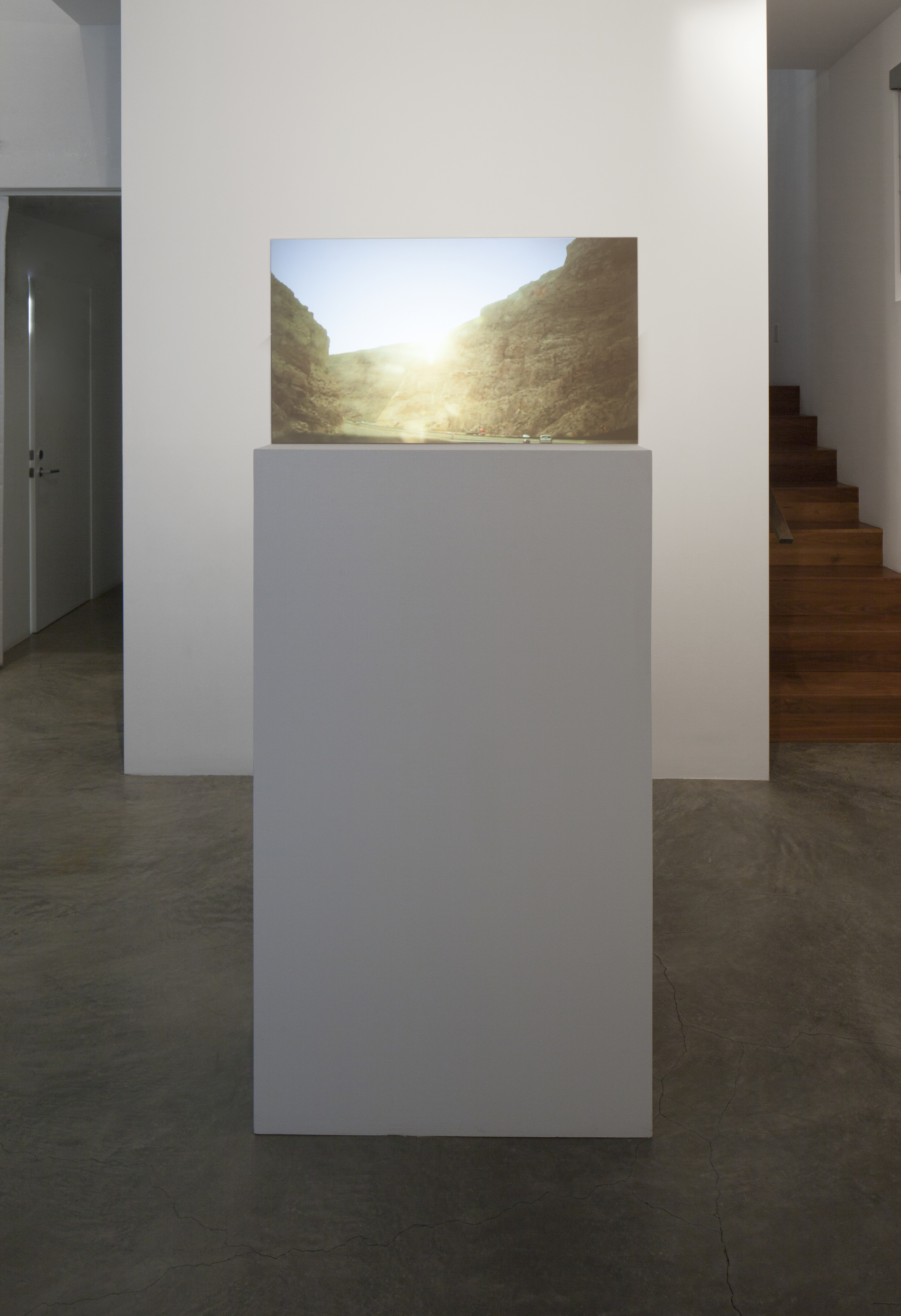  Installation View &nbsp;(Shulamit Gallery, 2014)   Prodigal Sun,&nbsp; 2013 Single Channel&nbsp;HD Video Projection onto Glass in Pedestal, No&nbsp;Sound, TRT 2:20, Looping 69 x&nbsp;30 x&nbsp;12&nbsp;Inches (Pedestal and Glass) 
