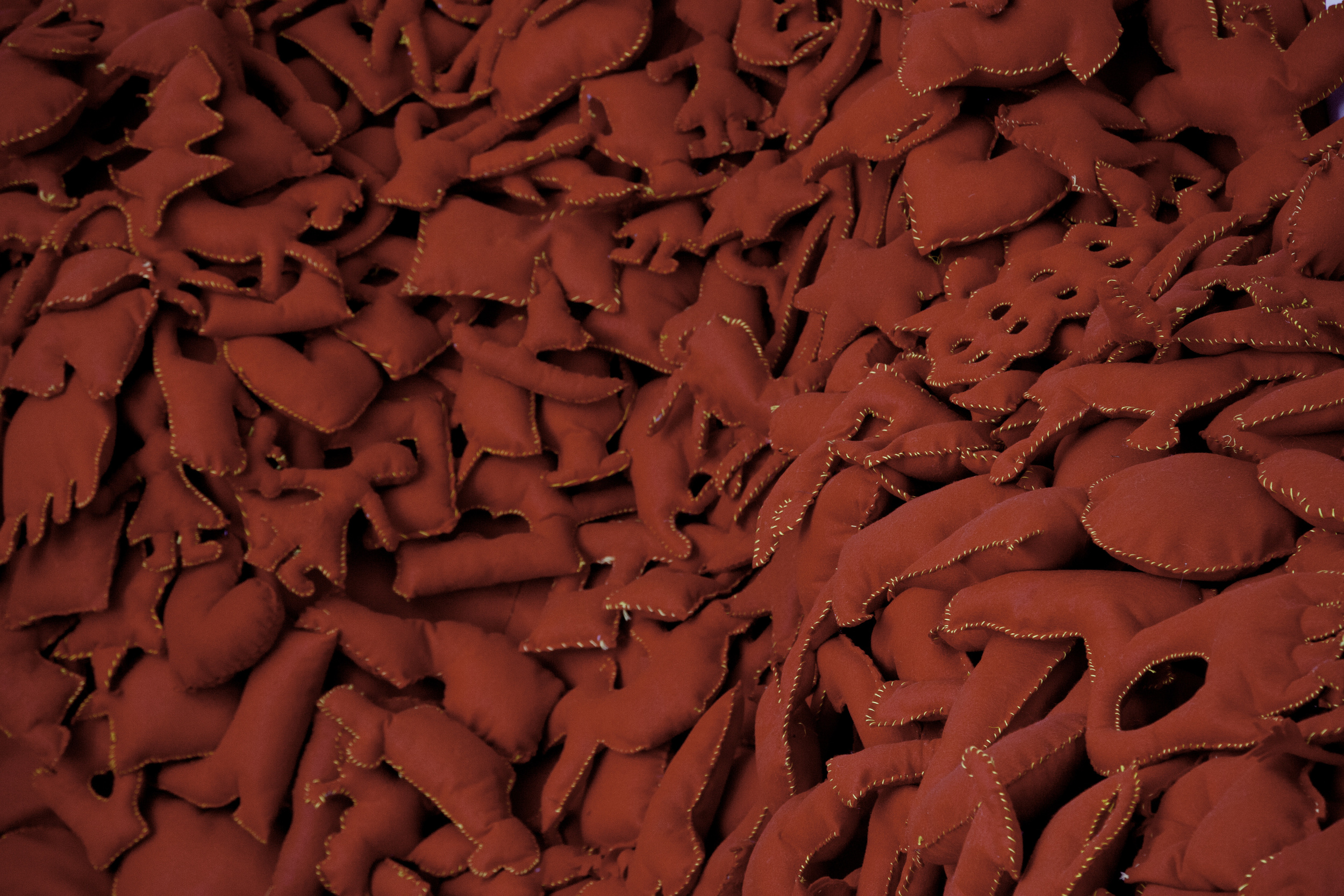  Installation Detail of Hand-Stitched Red Felt Objects&nbsp; (Shulamit Gallery, 2014)   The Pile,&nbsp; 2014 Single Channel HD Video Projection with Sound (16mm Film), TRT 12:00, Looping; Digital C-Prints; Hand-Stitched Red Felt Objects Installation 