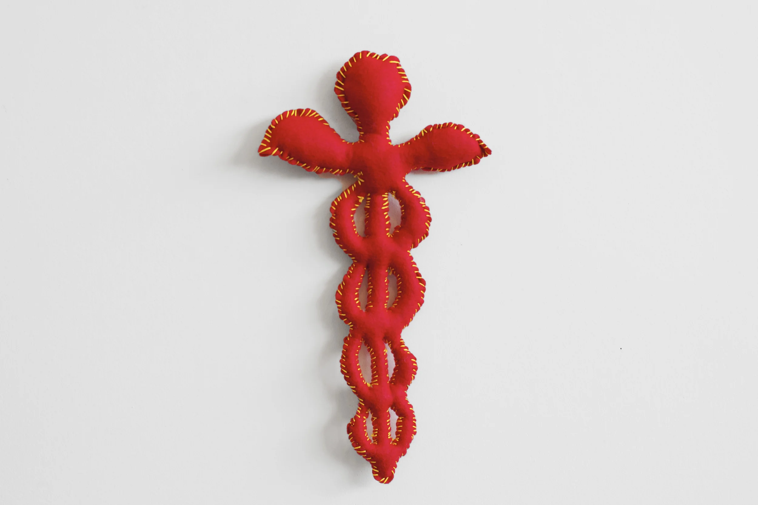 Installation Detail of Hand-Stitched Red Felt Objects The Pile, 2014 Single Channel HD Video Projection with Sound (16mm Film), TRT 12:00, Looping; Digital C-Prints; Hand-Stitched Red Felt Objects Installation Dimensions Variable