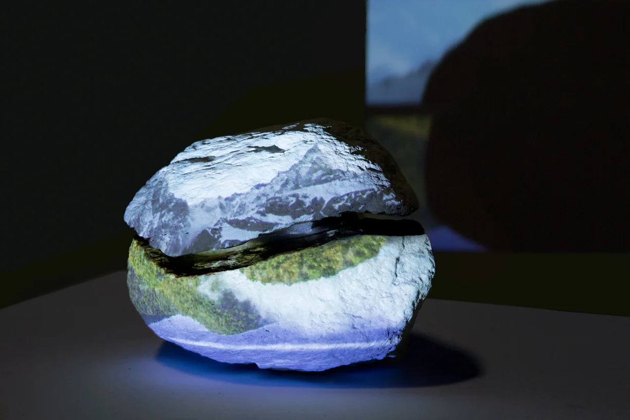 Installation View Mountain is a Mountain, Work In Progress Single channel HD video with sound projected onto rock, TRT approximately 10:00 minutes