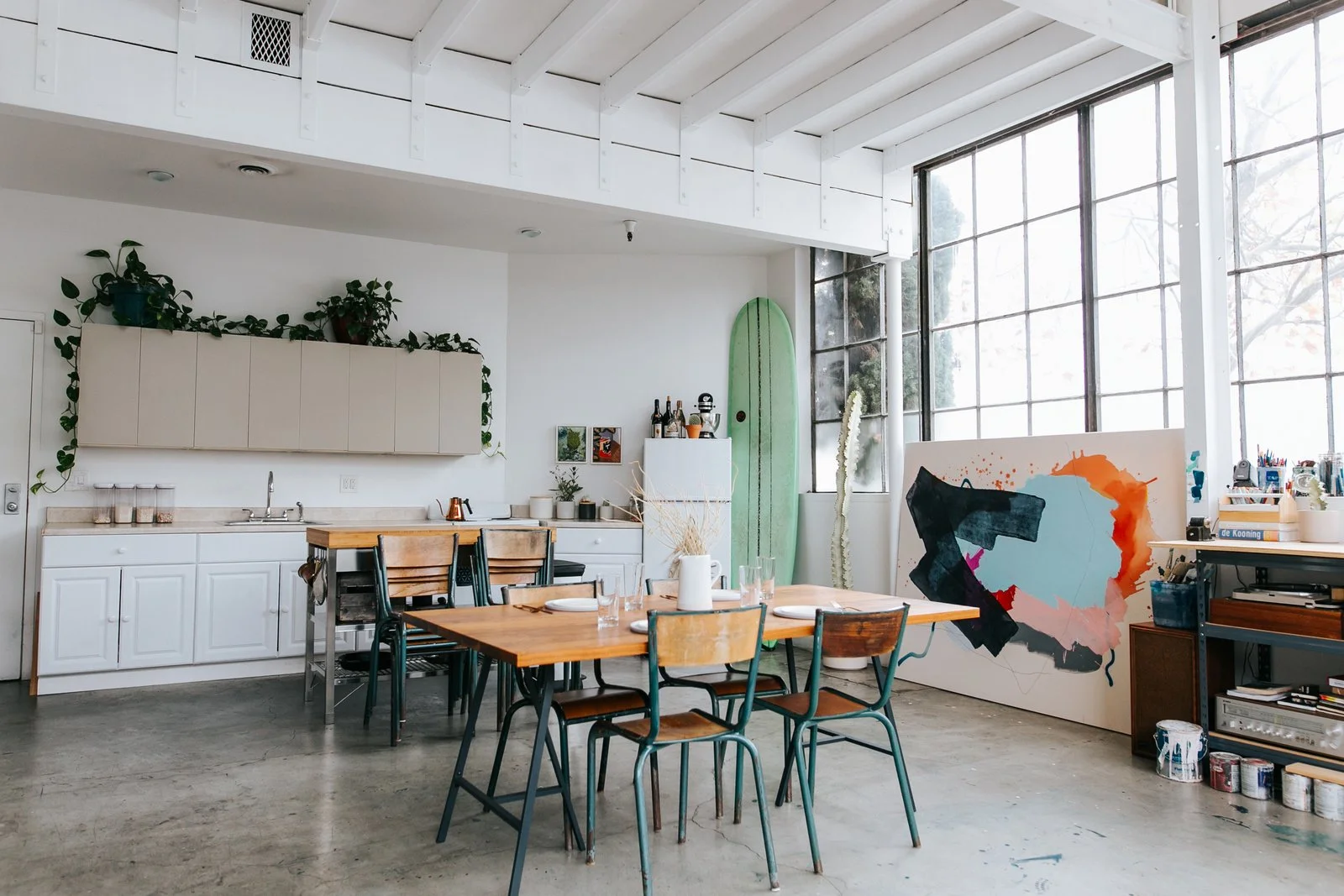"The dining room table, the flat files bench, and the mobile shelving unit on the second floor were designed by Justin Godar specifically for the space. They all serve multiple purposes, and also marry form with function."