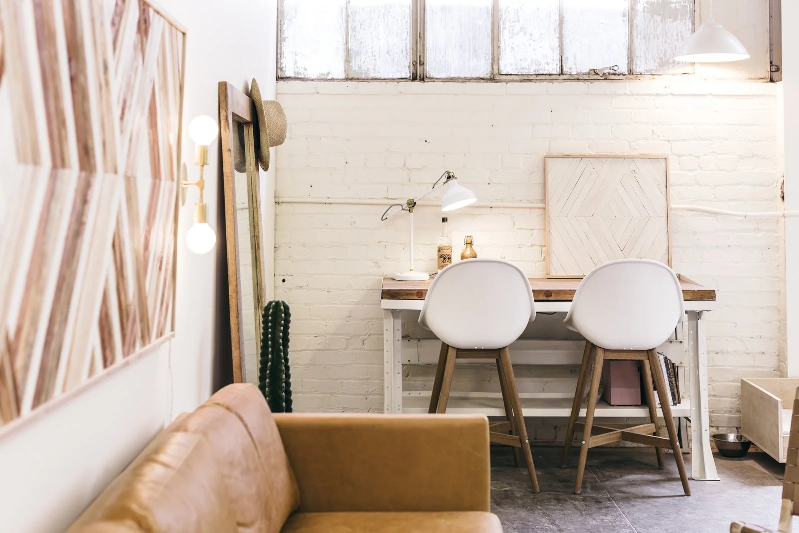 Zee added a desk—a vintage metal piece that she topped with a wood slab—to a dedicated office space.