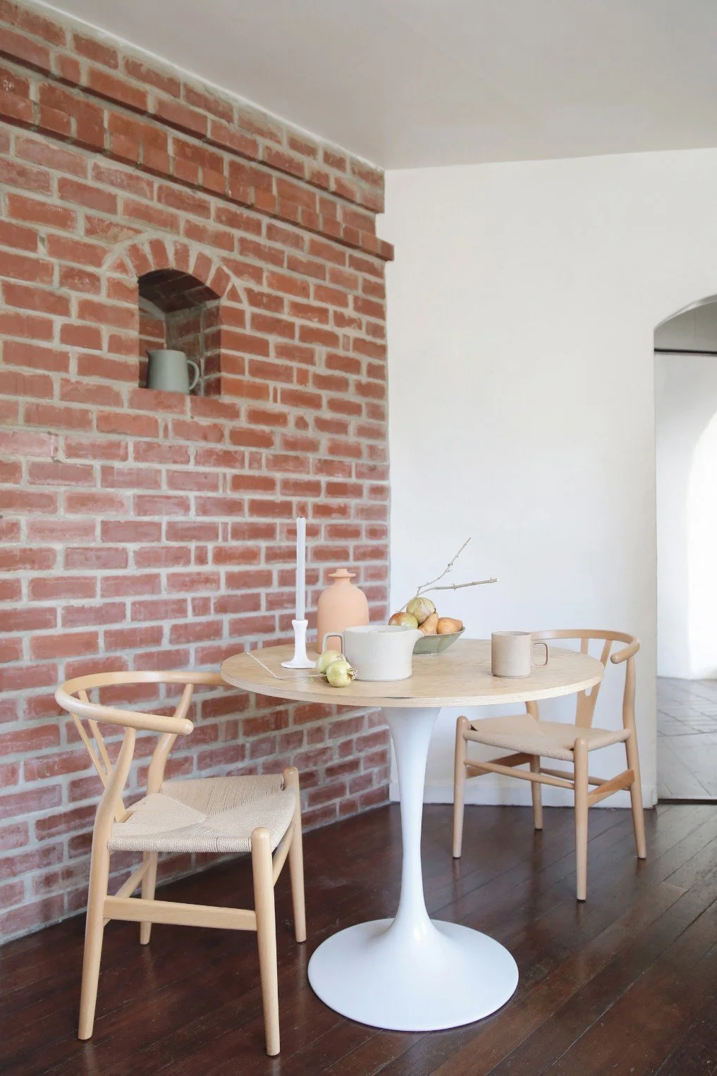 Modern pieces, too, now penetrate the rooms, playing off the curves of the walls and archways. She tries to keep it neutral to complement the existing architecture. (Leslie Santarina)