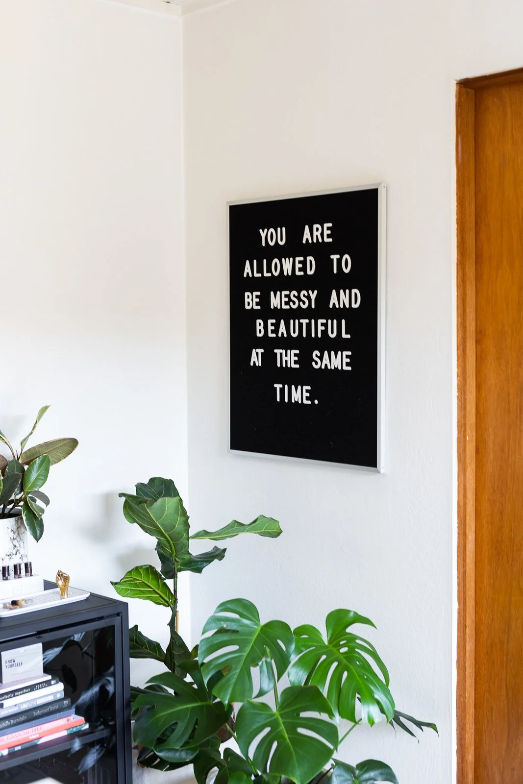 A positive affirmation hangs in Encarnacion's office. (Gillian Walsworth)