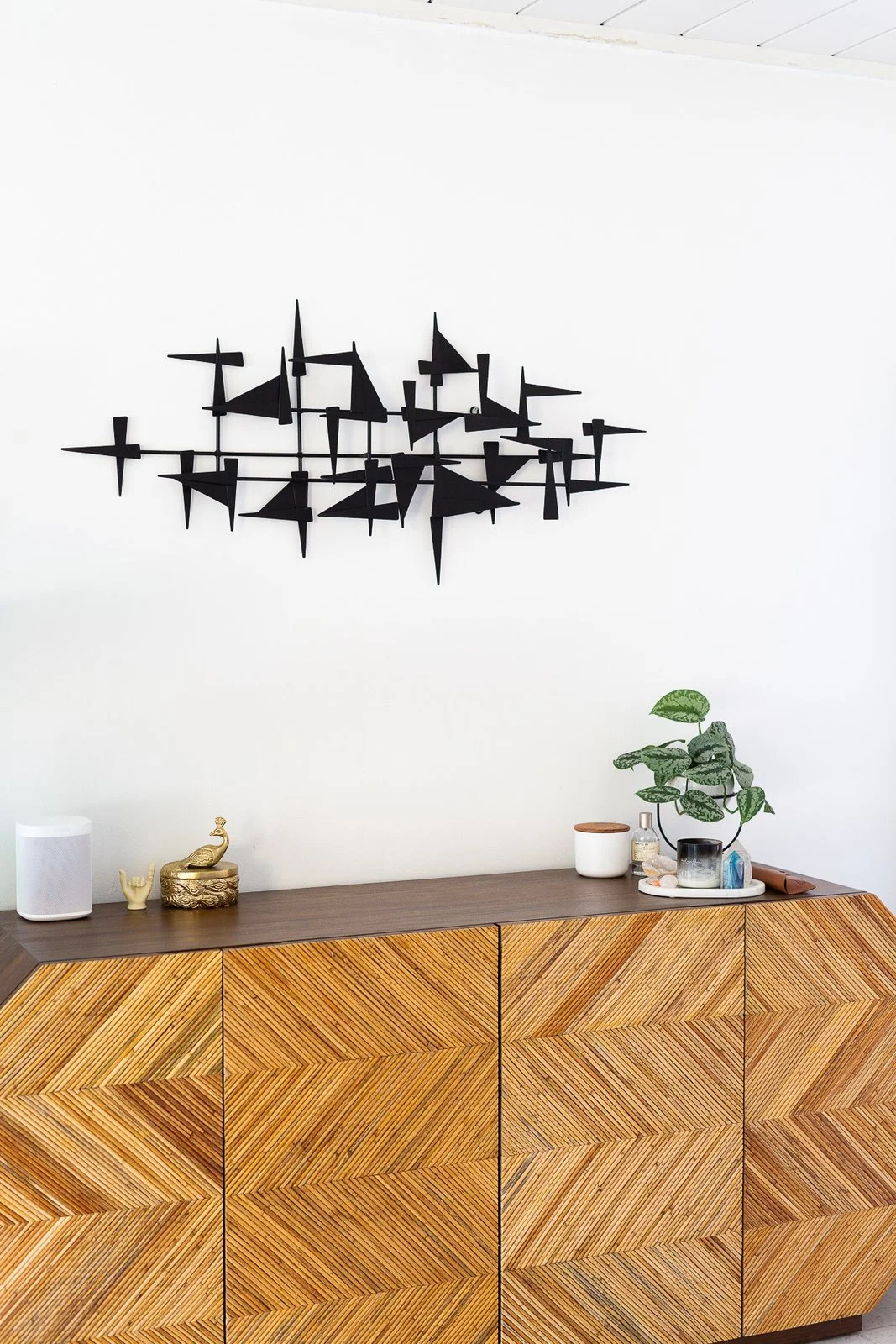 "I can’t help but giggle every time I see the bedroom credenza because Jon was so hesitant about it," says Encarnacion. "He felt it was too 'extra.' I was like, 'Come on, we’re grown-ass folks—we need something fun and bold. The moment it arrived, he was like, 'You know, I really love it.'" (Gillian Walsworth)