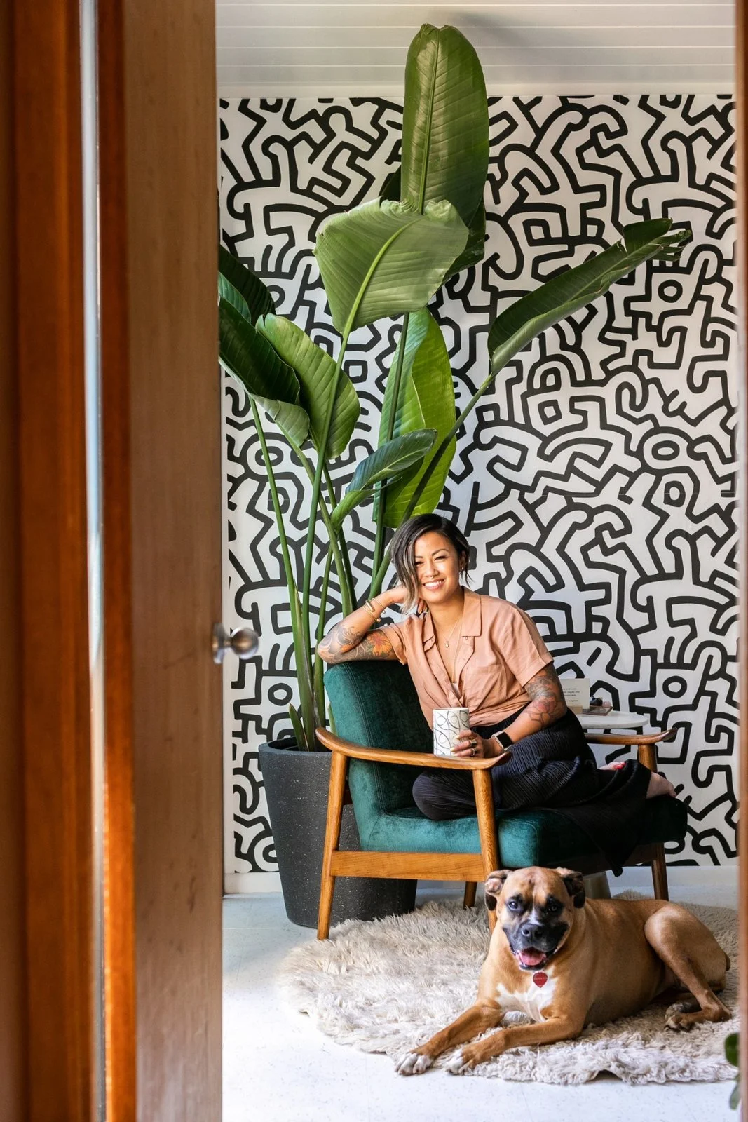 Encarnacion and Zoey soak up some sun in her office. (Sothear Nuon)