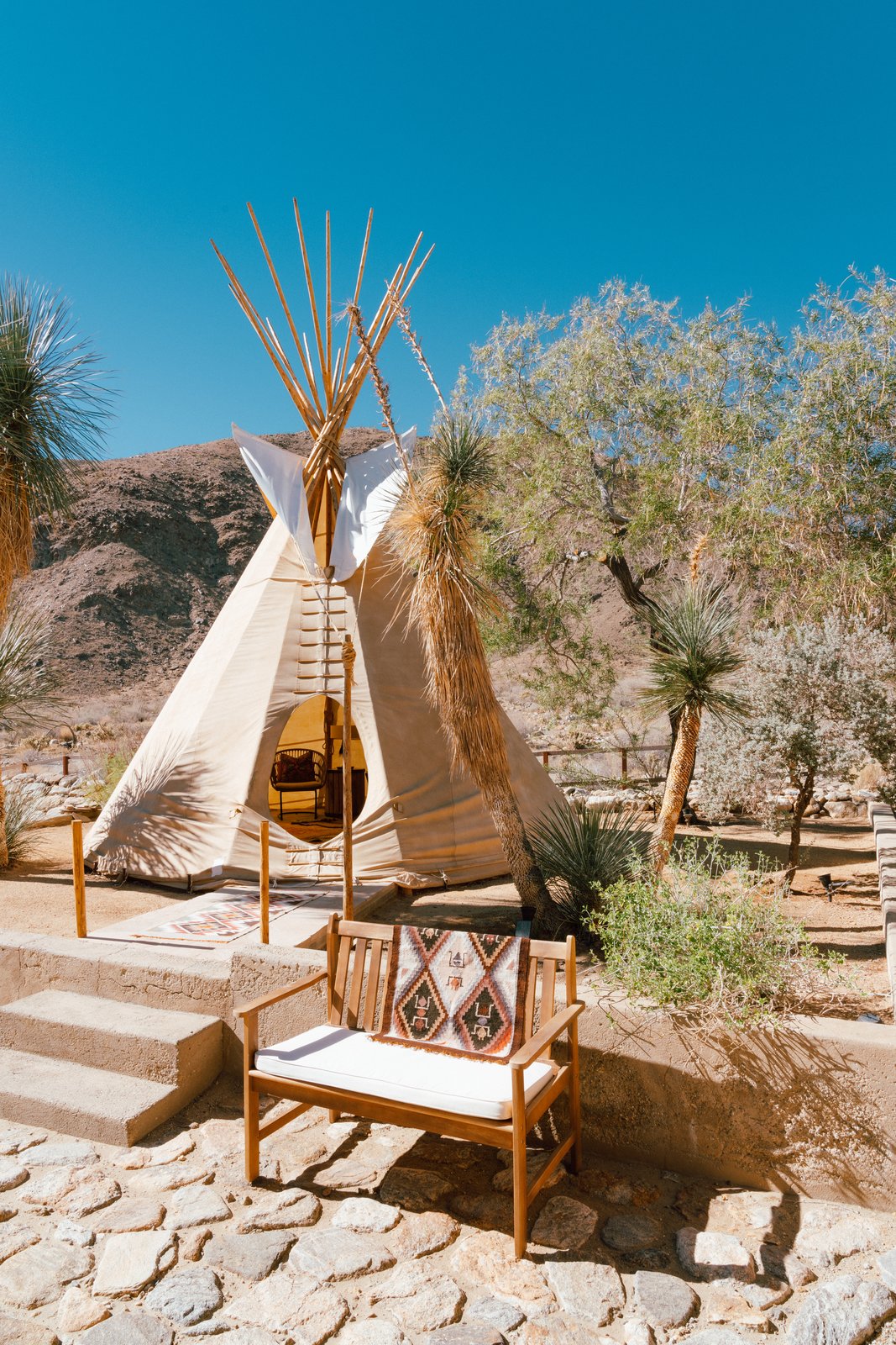 "The teepee is 26’ canvas with pine lodge poles. It’s simple in construction as it was originally intended to be a nomadic dwelling. It is extremely reliable in the high desert winds and even great in the rain. We have a small fire pit in there to keep it toasty on cool winter evenings. It’s one my favorite places on the property." (Tim Melideo)