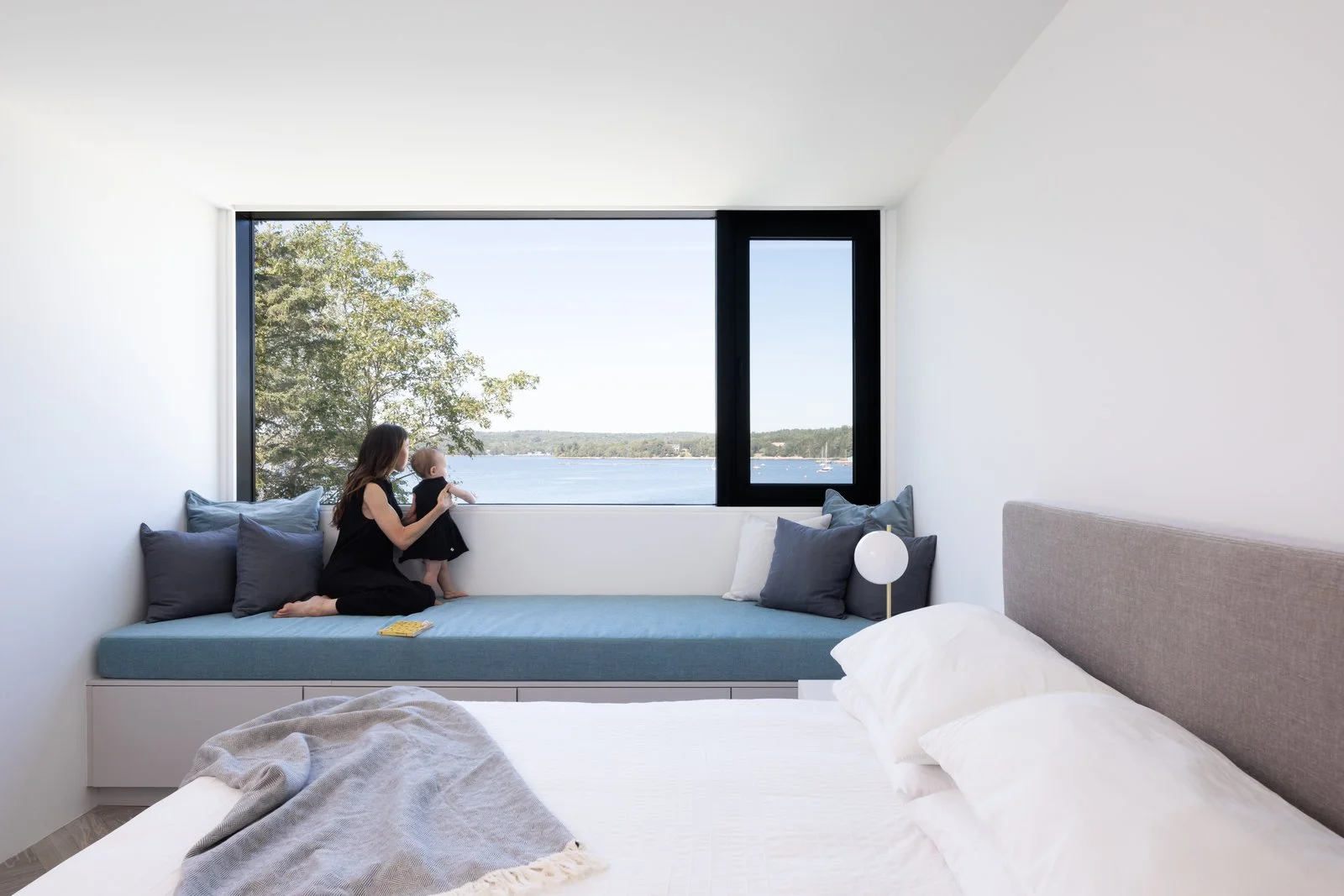 A cozy nook in one of the bedrooms opens up to a coastal breeze. (Ema Peter Photography)