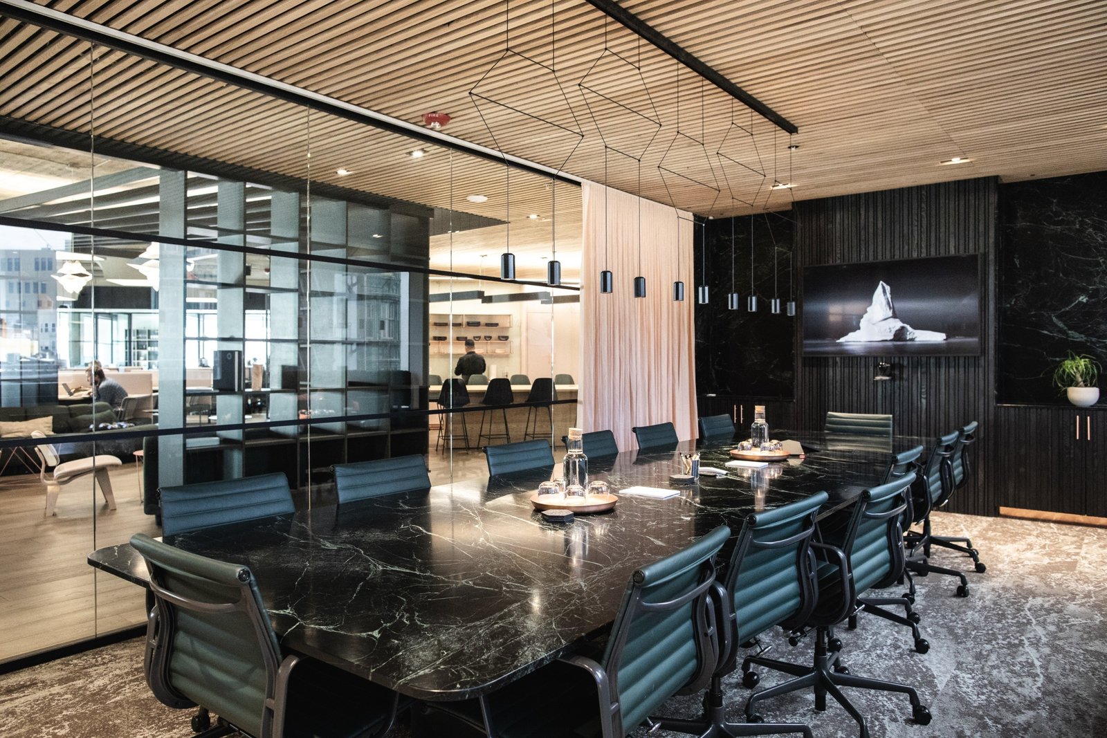Custom-designed conference tables made of blackened ash and Verde Alpi green-and-black marble offer a dramatic space to brainstorm and collaborate. (Sothear Nuon)