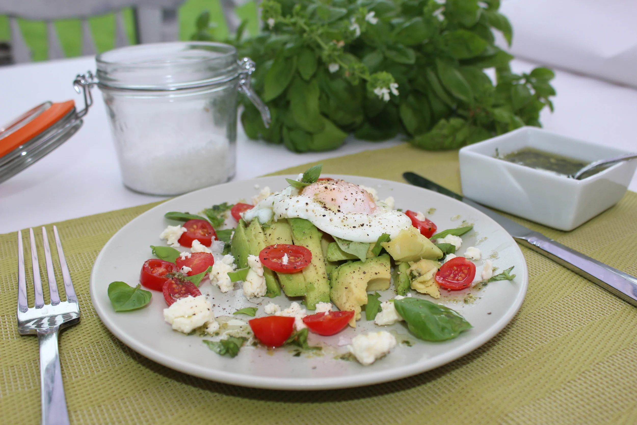 Poached egg on a bed of avocado - full of good fats!