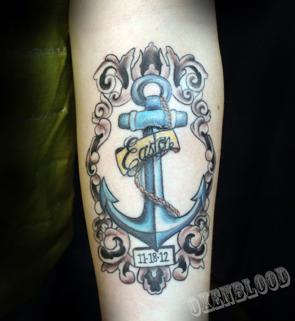 Anchor and filigree on forearm
