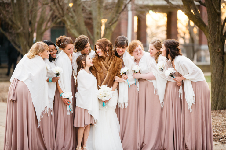 Bridesmaids laughing wearing pink long gowns