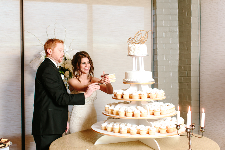 Bride and Groom cutting the cake at the reception