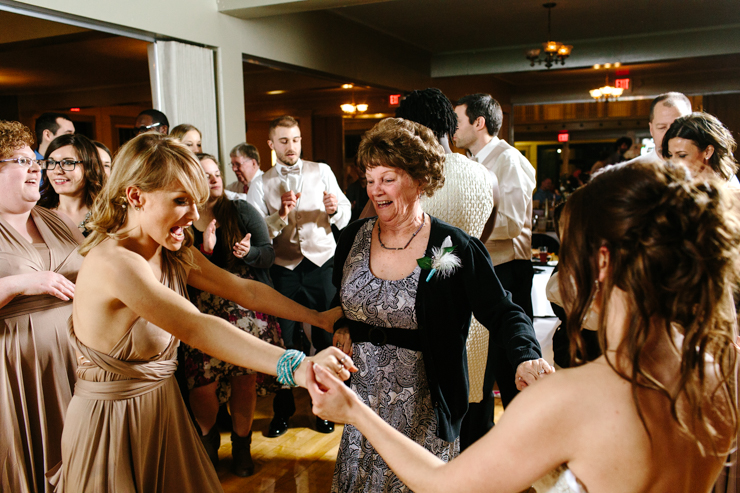 bride danging with her grandma at her wedding reception