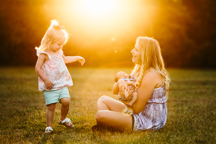 Mother and children in field
