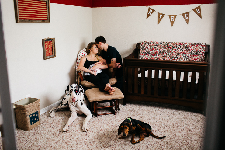 Family in Baby's Nursery with Dogs