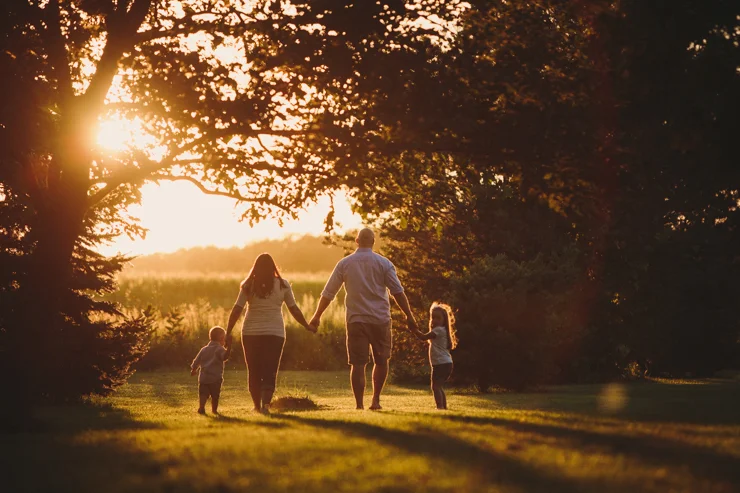 Family walking into the sunset