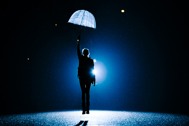 Levitation Photography with an umbrella in the pouring rain