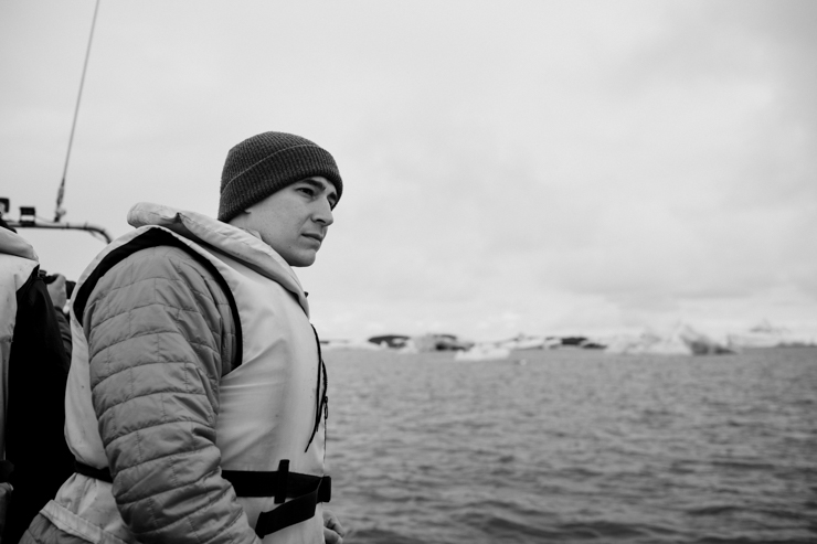 Man taking boat tour in the Jokulsarlon Glacier Lagoon, Iceland
