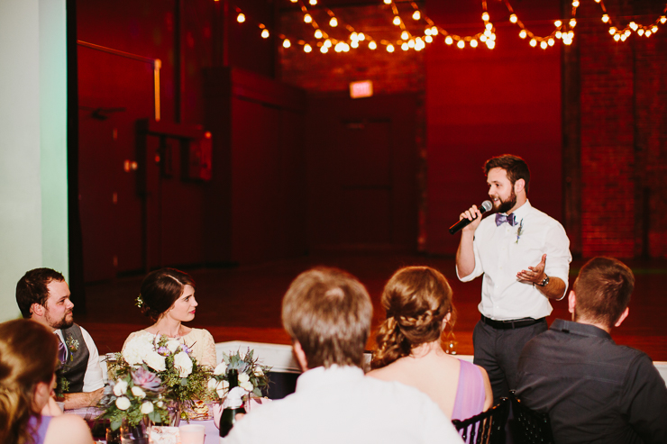 Bride and Groom listening to wedding toasts in Kansas City