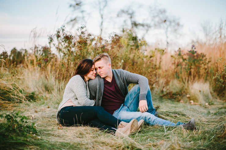 Engagement photos in a countryside field of flowers